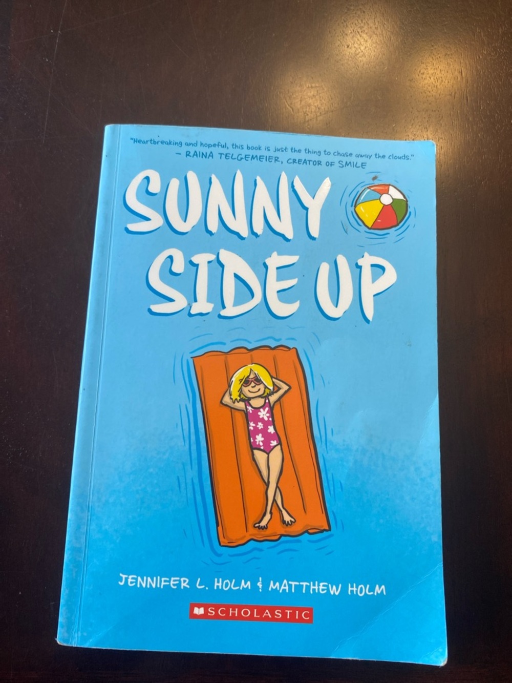 Scholastic Sunny Side Up — Blue Cover with Orange Float